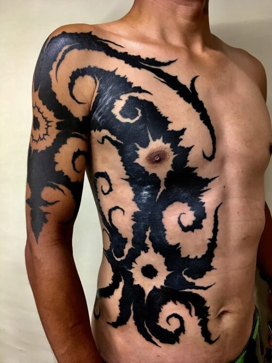 Tribal tattoo and modern black work by Taku Oshima - Tattoo Life